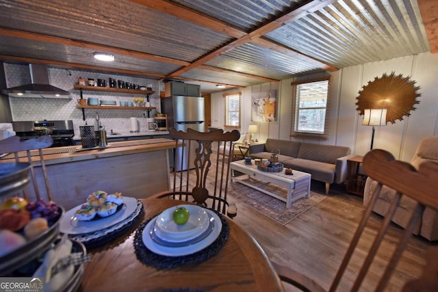 living room with hardwood / wood-style floors and sink