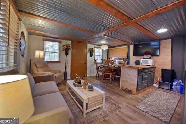 living room with plenty of natural light and hardwood / wood-style flooring