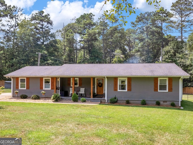 ranch-style home featuring a porch and a front lawn