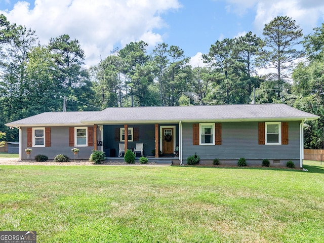 ranch-style home featuring a front lawn