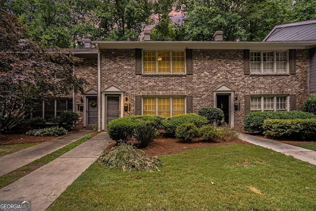 view of front of home with a yard