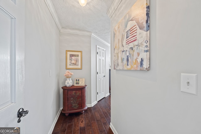 hallway with crown molding, dark hardwood / wood-style flooring, and a textured ceiling