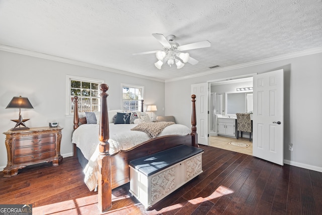 bedroom featuring ensuite bath, ceiling fan, dark wood-type flooring, crown molding, and a textured ceiling