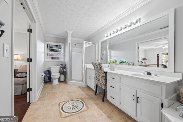 bathroom with ceiling fan, toilet, ornamental molding, a textured ceiling, and walk in shower