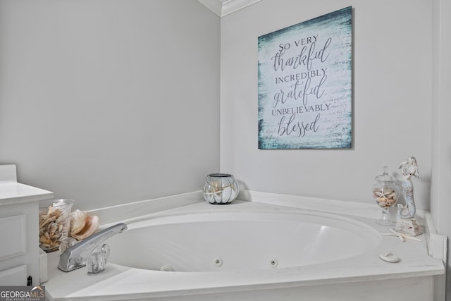 bathroom featuring a bath and ornamental molding