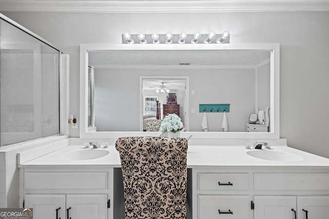 bathroom with vanity, ceiling fan, crown molding, and walk in shower