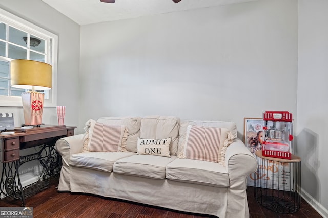 living room with dark hardwood / wood-style floors and ceiling fan