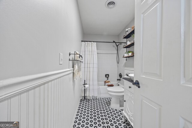 bathroom featuring toilet and shower / bathtub combination with curtain