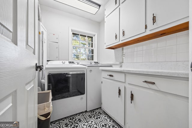 laundry area featuring cabinets and independent washer and dryer