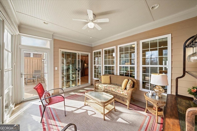 sunroom featuring a ceiling fan