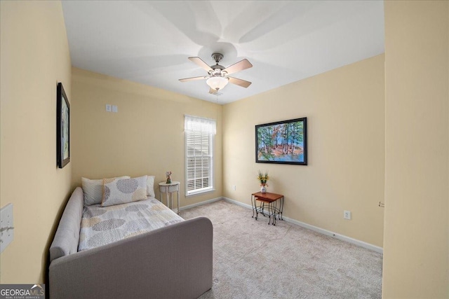 bedroom featuring light colored carpet and ceiling fan