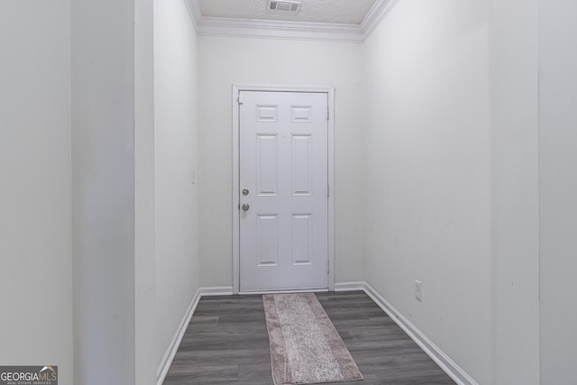 entryway featuring a textured ceiling, dark hardwood / wood-style floors, and crown molding