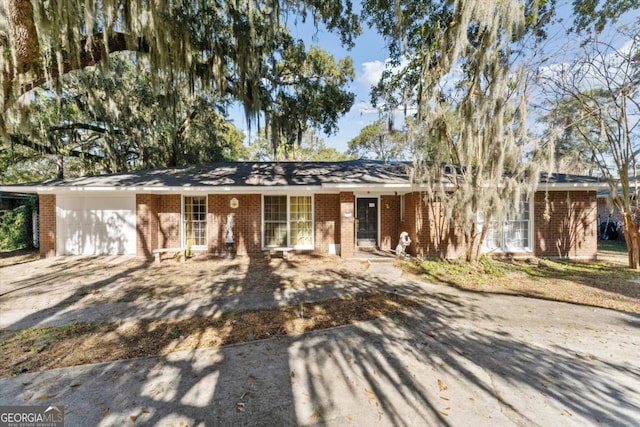 single story home featuring a garage