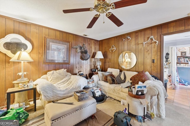 living room with ceiling fan and light tile patterned floors