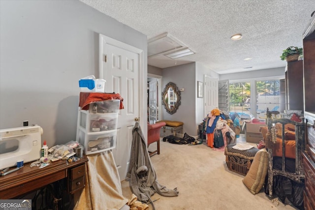 interior space featuring carpet flooring and a textured ceiling