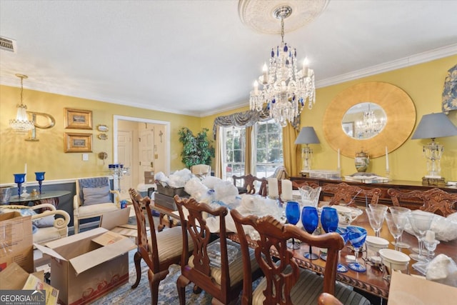 dining room featuring crown molding and an inviting chandelier