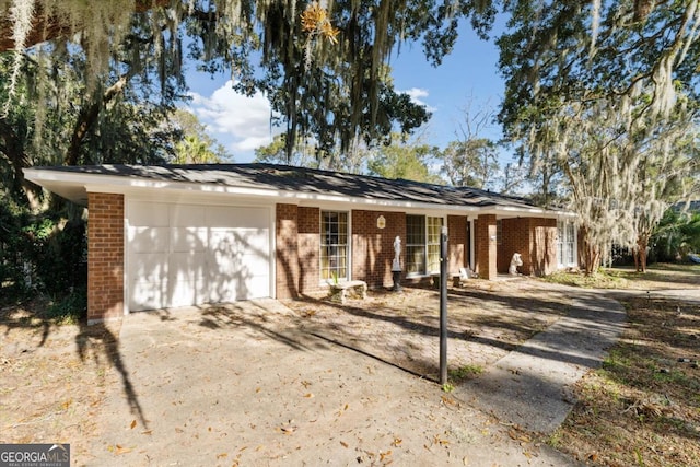 single story home featuring a garage