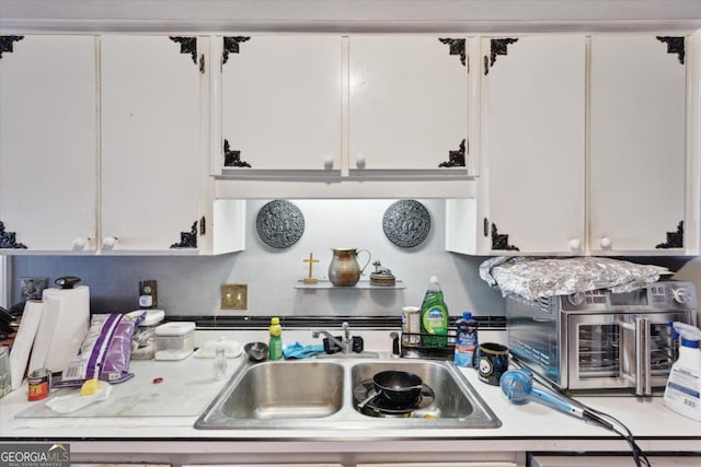 kitchen with white cabinets and sink