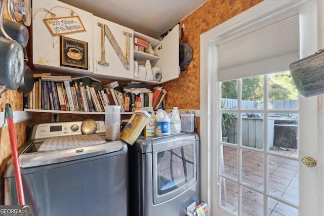 laundry area featuring washing machine and clothes dryer