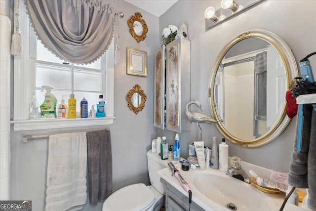 bathroom with vanity and toilet