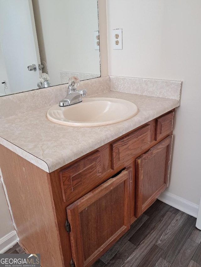 bathroom featuring hardwood / wood-style floors and vanity