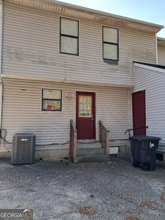 back of property with central AC unit