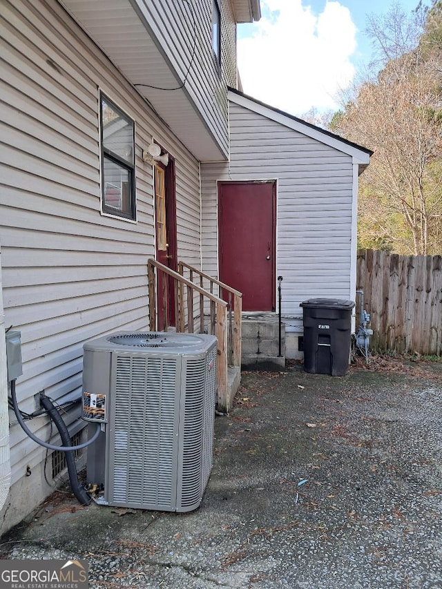 doorway to property featuring cooling unit