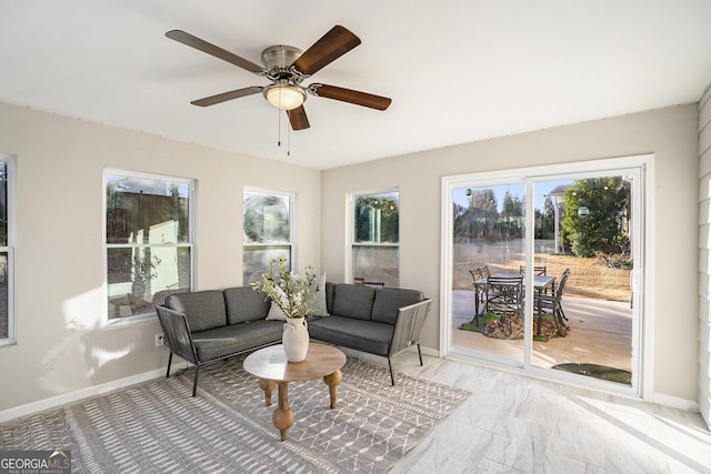 sunroom / solarium with ceiling fan