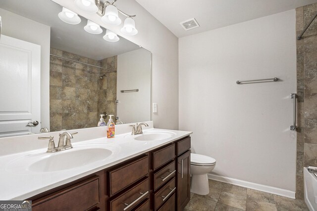 bathroom with vanity and a shower with shower door