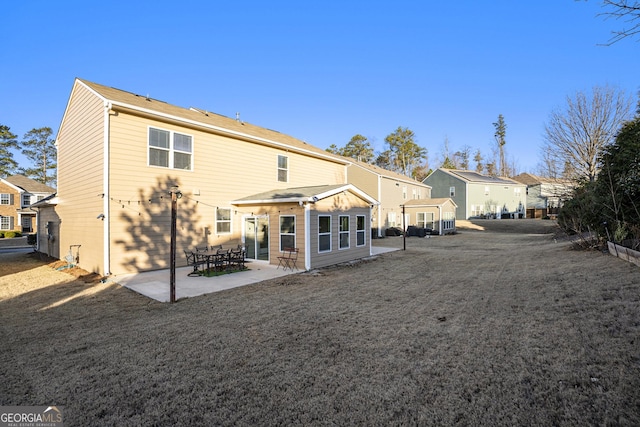 rear view of property featuring a patio