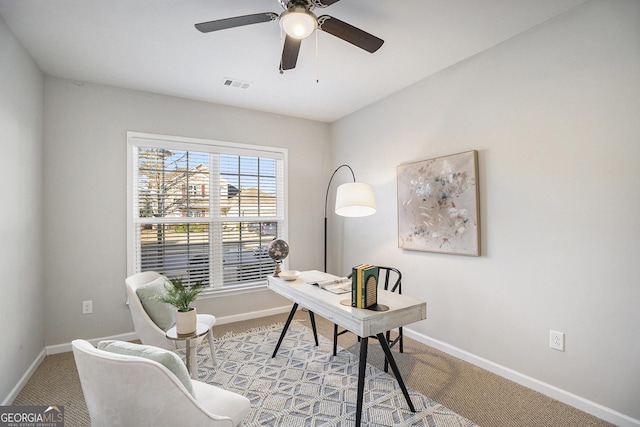 carpeted office with ceiling fan