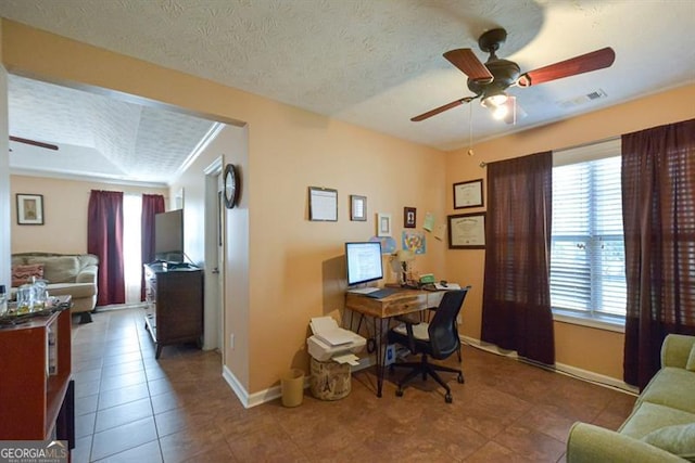 tiled office space with a textured ceiling, plenty of natural light, and crown molding