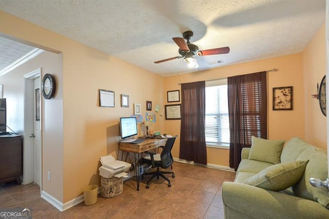 office with ceiling fan, light tile patterned flooring, and a textured ceiling