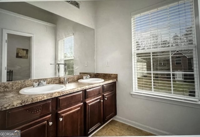 bathroom with tile patterned floors and vanity