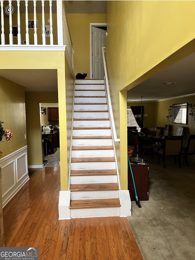 staircase featuring hardwood / wood-style floors