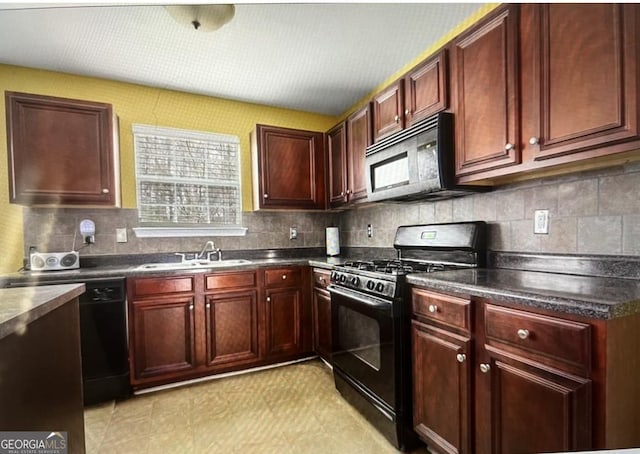 kitchen featuring decorative backsplash, sink, and black appliances