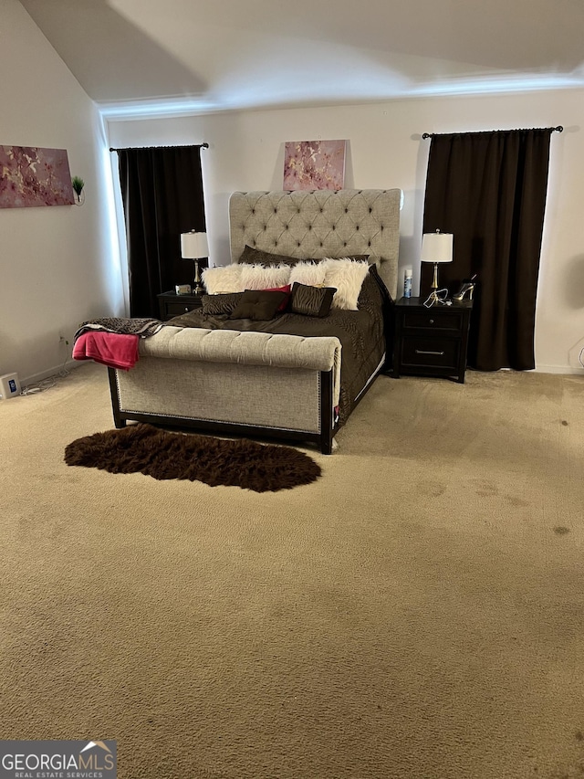 bedroom with light colored carpet