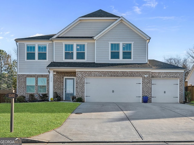 view of front of home featuring a front lawn and a garage