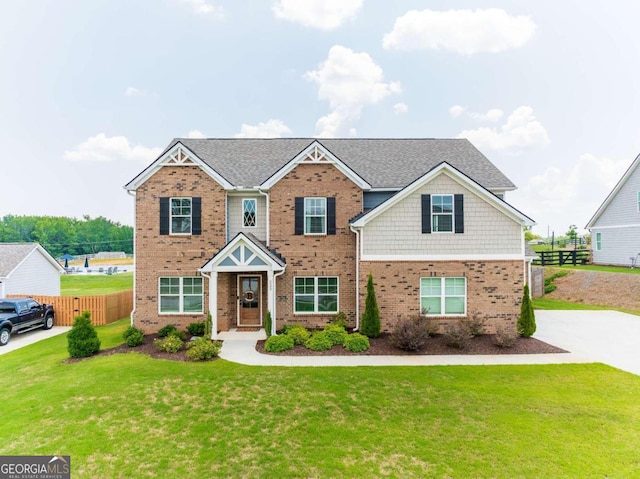 craftsman-style home with a front yard