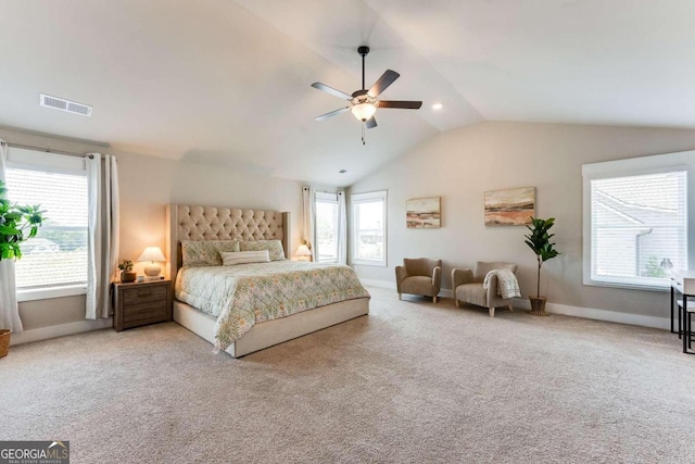 carpeted bedroom featuring ceiling fan and vaulted ceiling