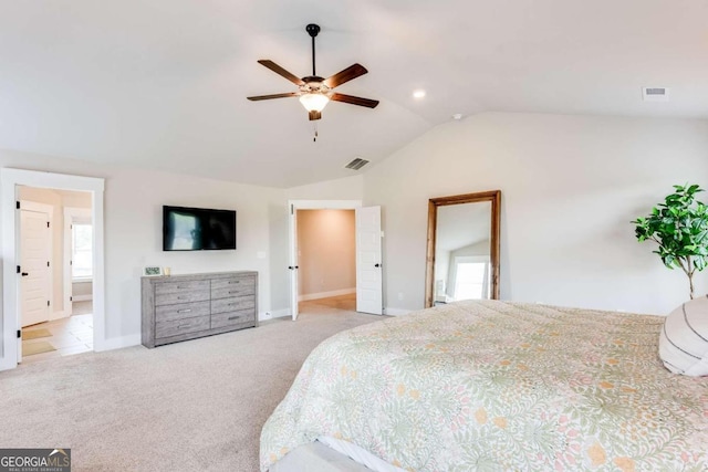 bedroom featuring ceiling fan, light colored carpet, multiple windows, and vaulted ceiling