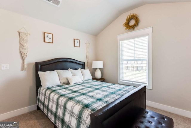 carpeted bedroom featuring vaulted ceiling