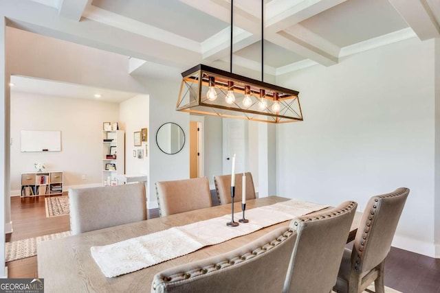 dining area featuring beam ceiling, crown molding, dark hardwood / wood-style floors, and coffered ceiling