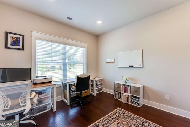 home office with dark hardwood / wood-style floors