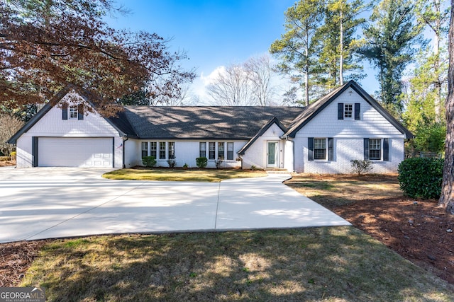 view of front of home featuring a garage and a front lawn