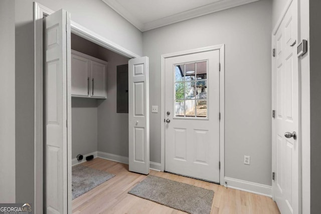 doorway to outside featuring light wood-type flooring and crown molding