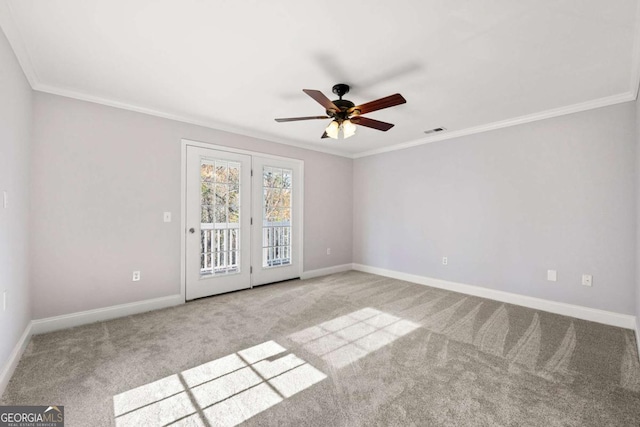 unfurnished room featuring ceiling fan, light colored carpet, and ornamental molding