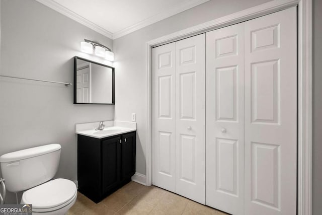 bathroom with tile patterned flooring, vanity, toilet, and ornamental molding