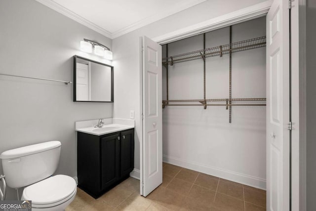 bathroom with crown molding, tile patterned flooring, vanity, and toilet