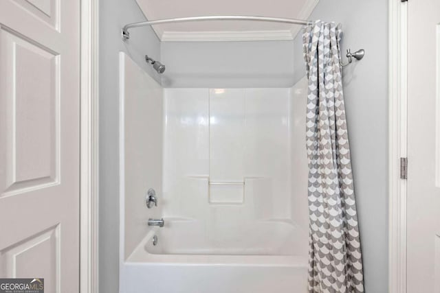 bathroom featuring shower / bath combo with shower curtain and ornamental molding